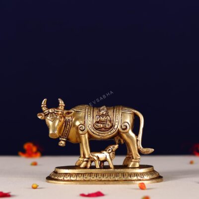 Brass kamdhenu carving with lord ganesh and kuber