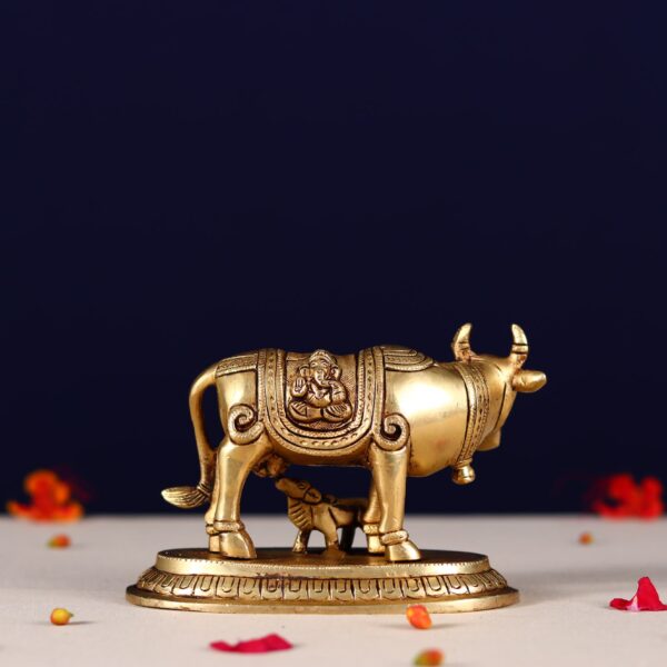 Brass kamdhenu carving with lord ganesh and kuber