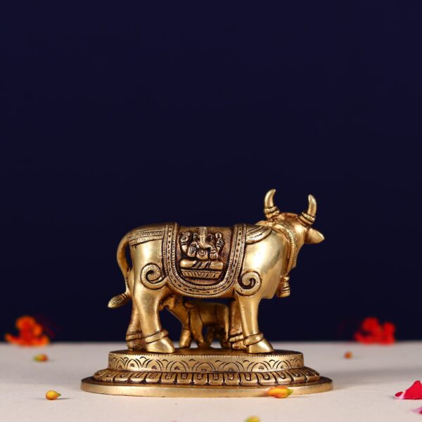 Brass kamdhenu carving with ganesh laxmi