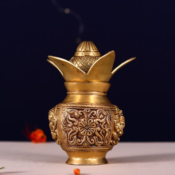 brass kalash with ganesh and lakshmi carving