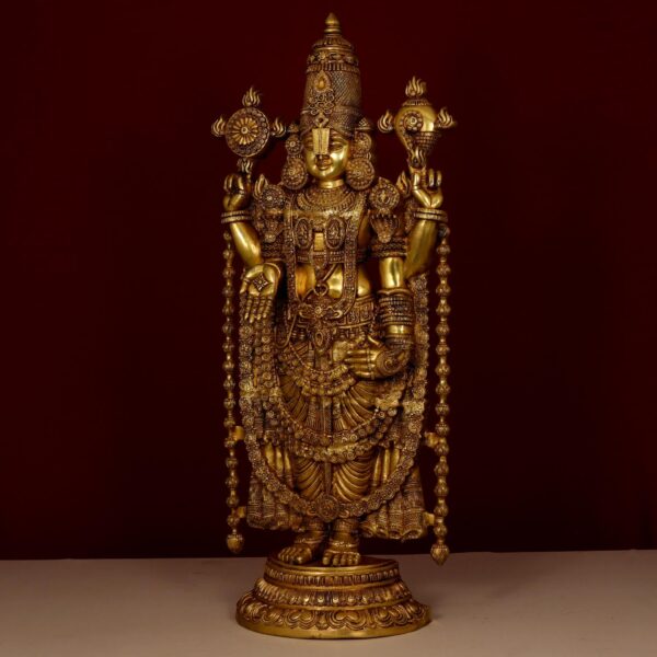 Intricate detailing on the crown highlights the craftsmanship of this brass Tirupati Balaji idol.