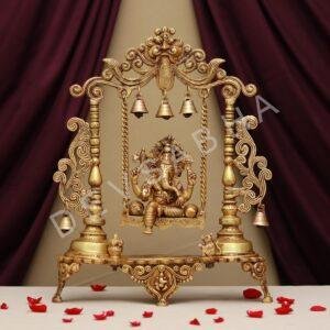 brass ganesh idol sitting on jhula