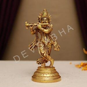 brass krishna playing flute