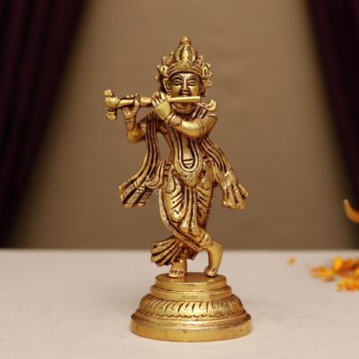 brass krishna playing flute