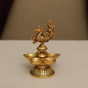 brass peacock diya