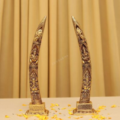 brass elephant tusk with ganesh crafted on it 12 inches