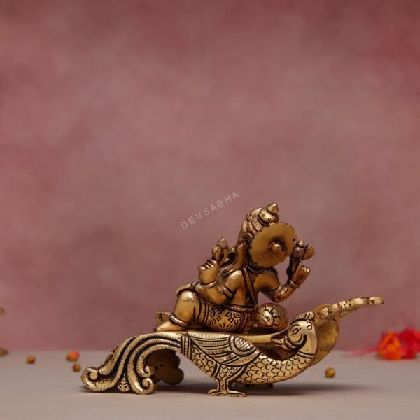 Brass Sofa Ganesha- Lord Ganesha Resting On Peacock Couch