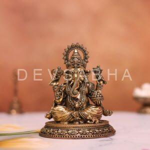 brass ganesh idol sitting