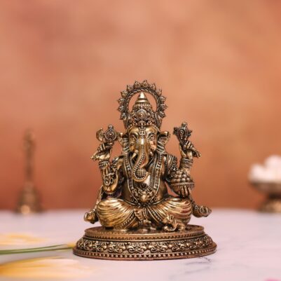 brass ganesh idol sitting