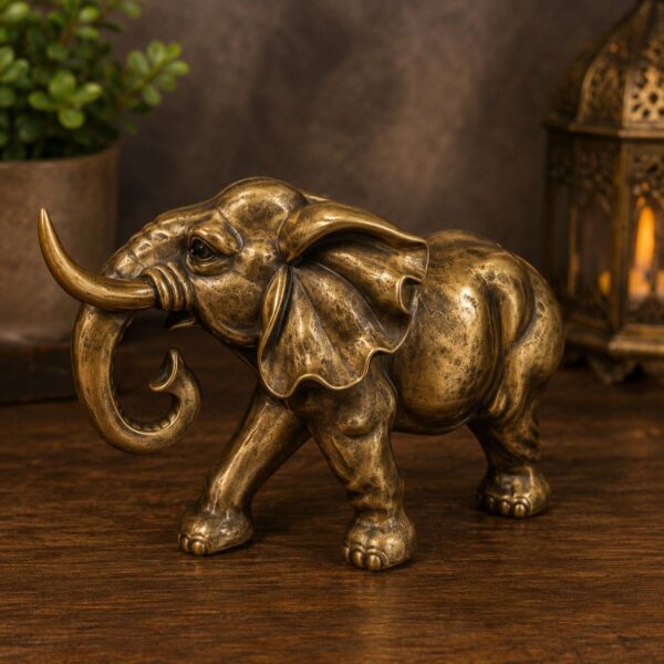 Bronze polished elephant figurine on table
