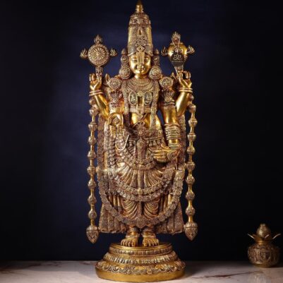Detailed golden metal sculpture standing on a round base showcasing tirupati balaji idol front view