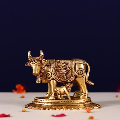 brass kamdhenu carving with lord ganesh and kuber