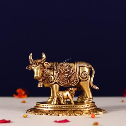 brass kamdhenu carving with lord ganesh and kuber