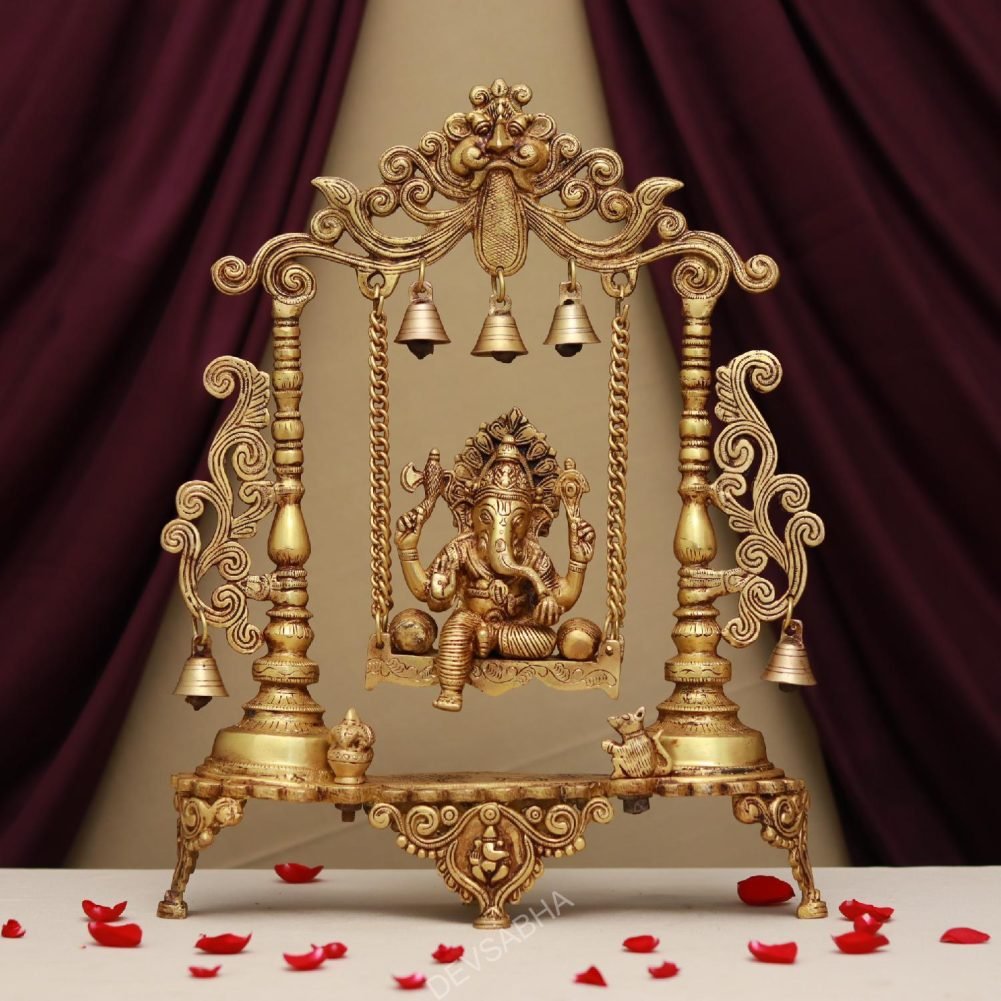 brass ganesh idol sitting on jhula
