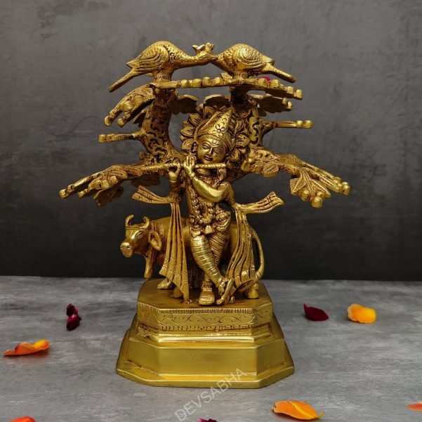 brass krishna idol under the kadamb tree