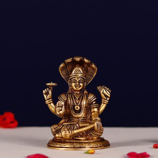 brass vishnu narayan murti sitting on shesh nag