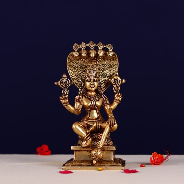 brass lord narayan statue sitting on shesh nag