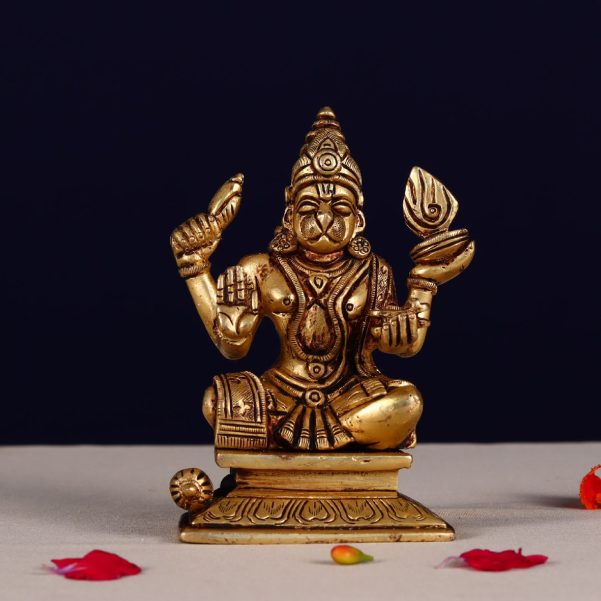 brass hanuman idol sitting on meditation with four hands