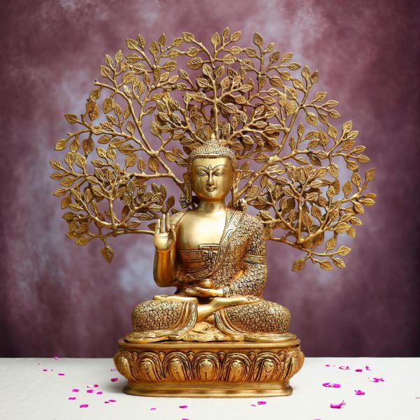 brass budhha statue with bodhi tree