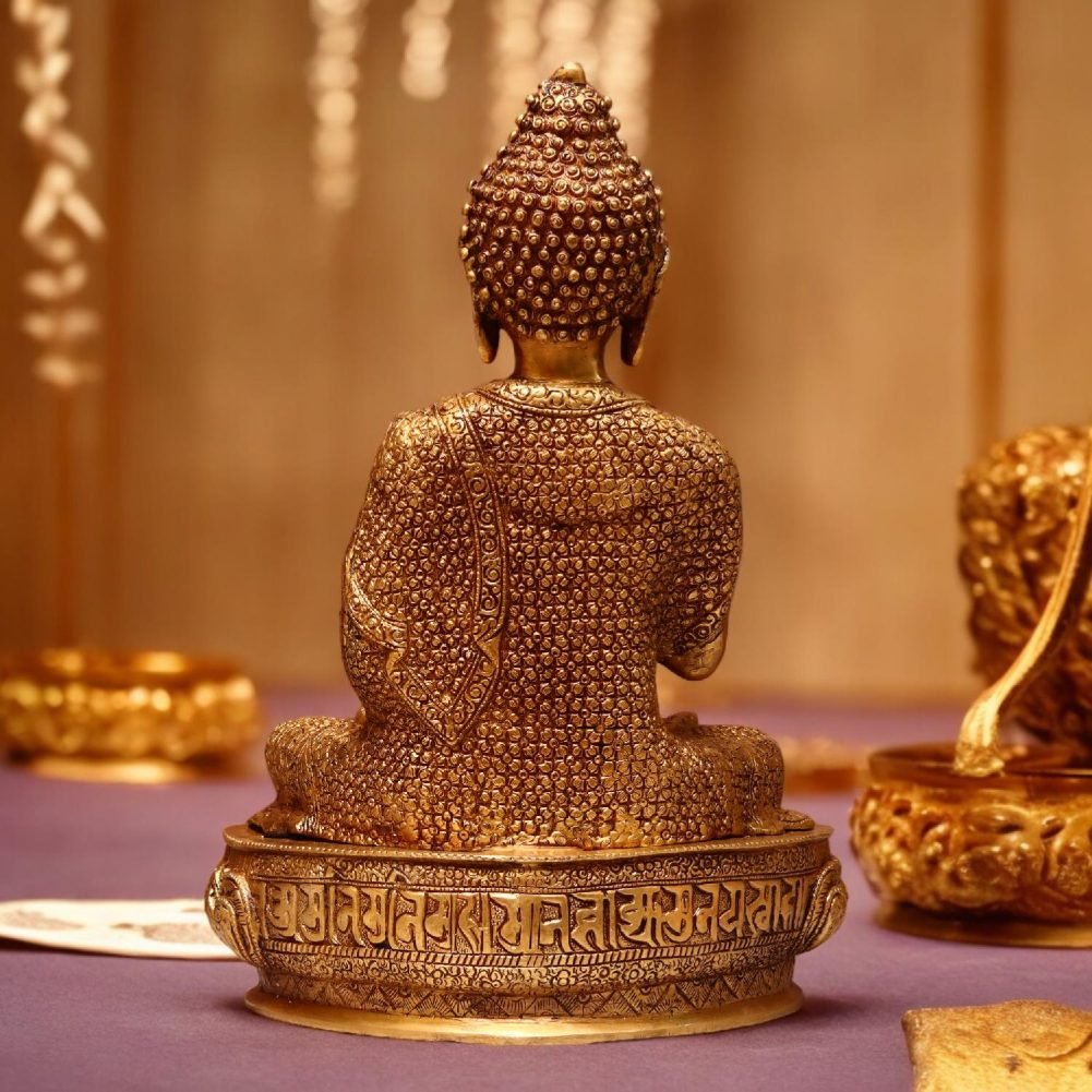 a statue of a buddha sitting on a table