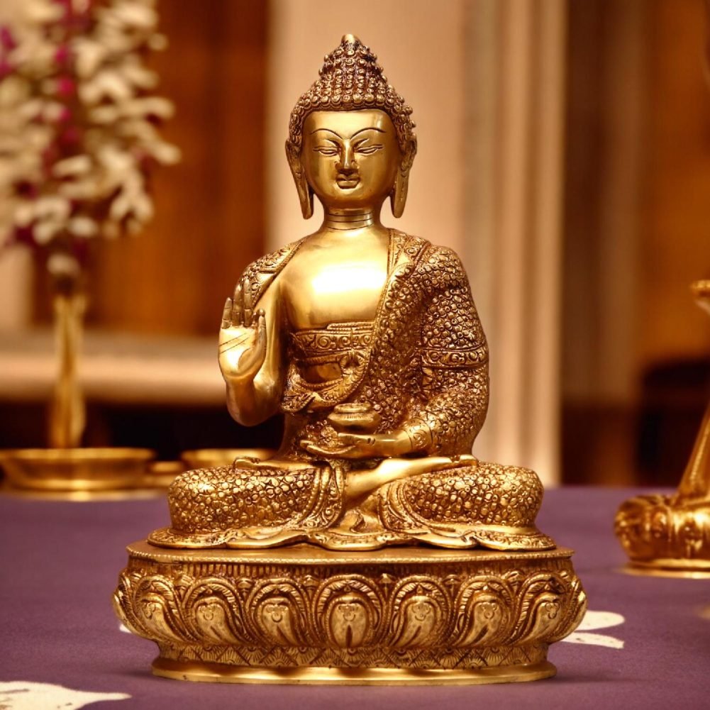a brass statue of a buddha